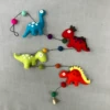 Dinosaur Felted Wool Garland Handcrafted In Nepal -FUNKO || Ooly || Enesco Shop Screenshot 2019 11 25 Faire Wholesale Reinvented 14